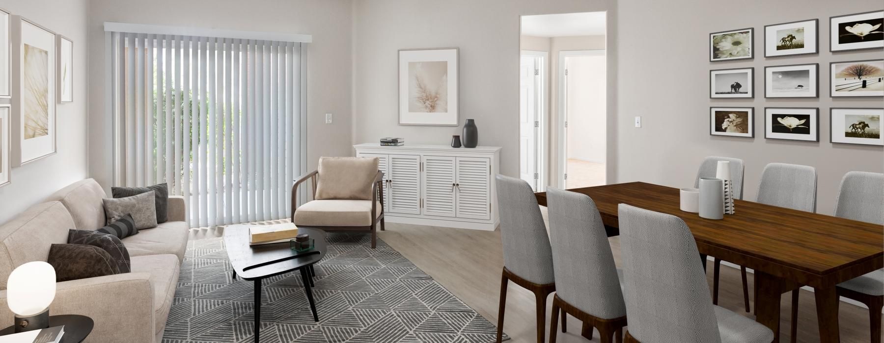 a living room with a table and chairs