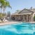 a swimming pool in front of a house