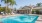 a swimming pool in front of a house