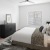 a bedroom with a bed and a lamp