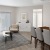 a living room with a table and chairs