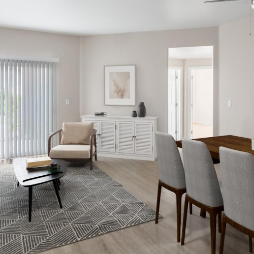 Wide open living areas flooded with natural light a living room with a table and chairs