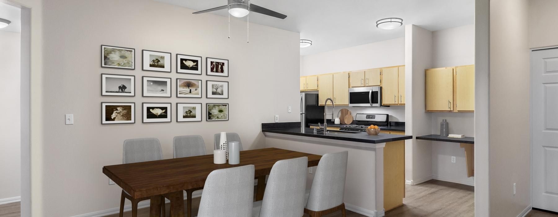 a kitchen with a table and chairs